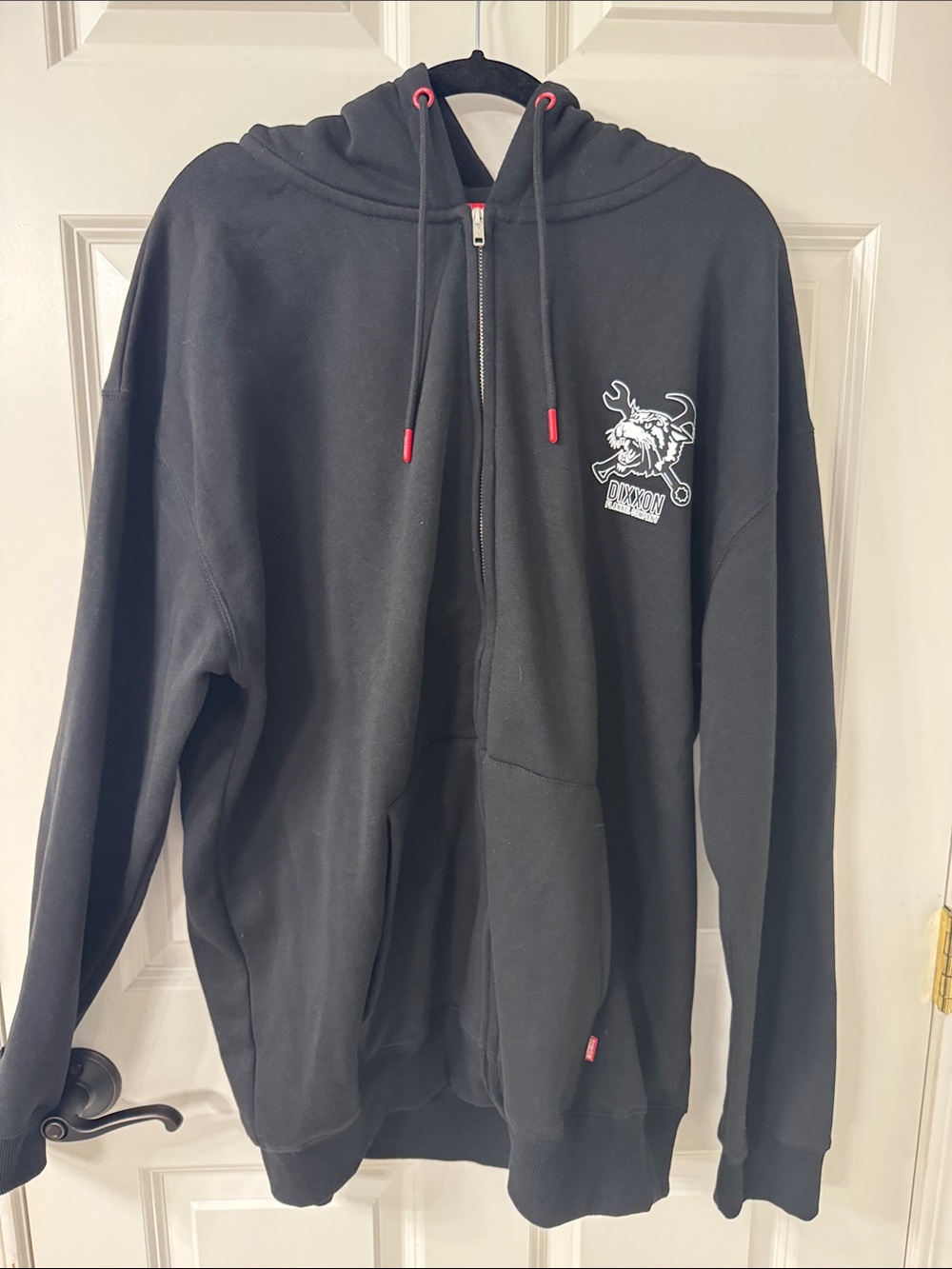 DIXXON Black Zip-Up Hoodie with White Chest Graphic and Red Drawstring Tips